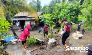 Polres Loteng Gotong Royong Bersihkan Lumpur Banjir